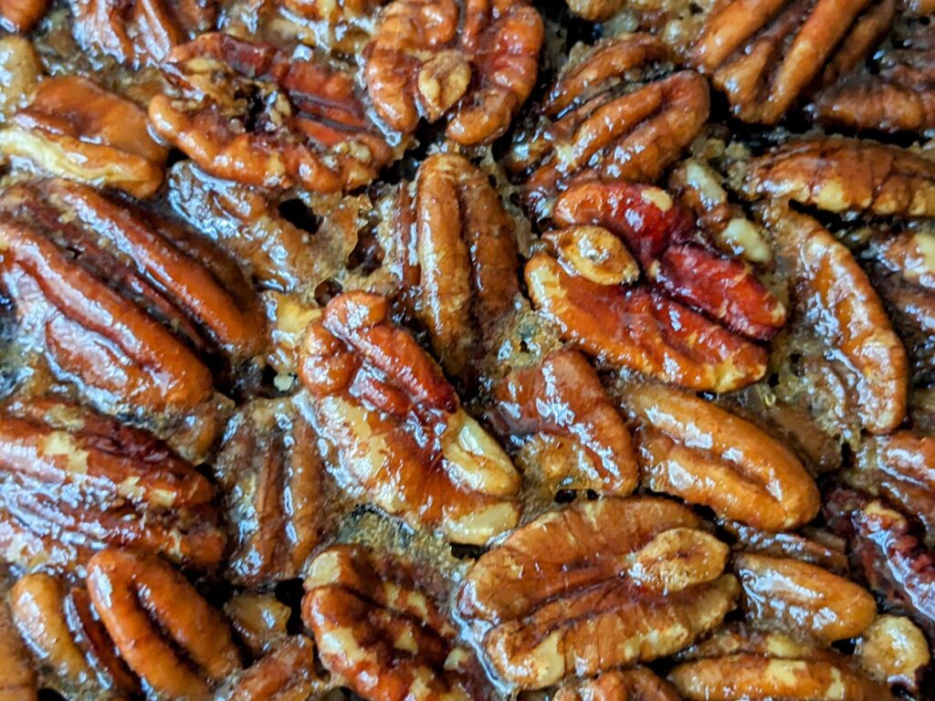 Pecans with glaze on top of Costco Kirkland Pecan Pie.