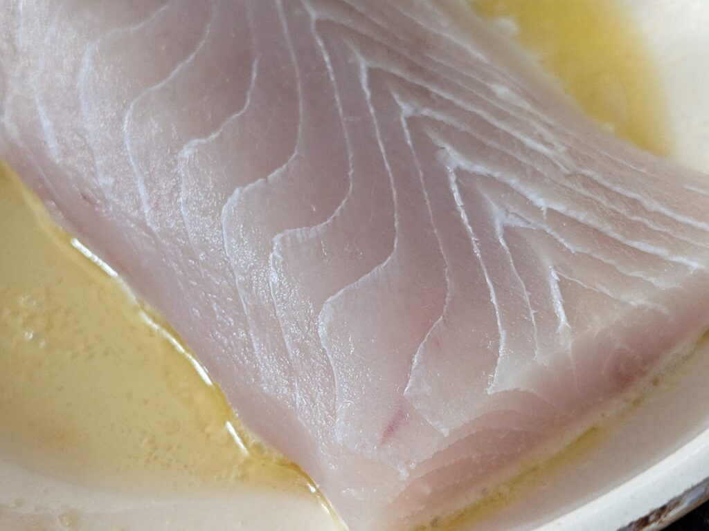 Close-up of raw mahi-mahi filet from Costco's Kirkland store brand.