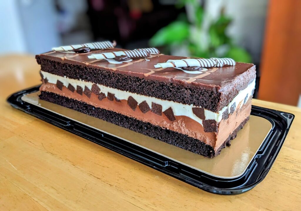 A whole bar of Costco Tuxedo Cake, sitting on a table.