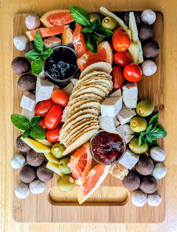 A meat, cheese, fruit, and vegetable charcuterie board made with Costco Turkey Breast.