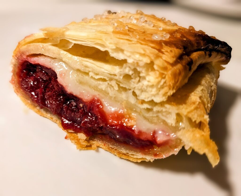 Cross-section of a baked Specially Selected Cherry Mascarpone Strudel from Aldi.