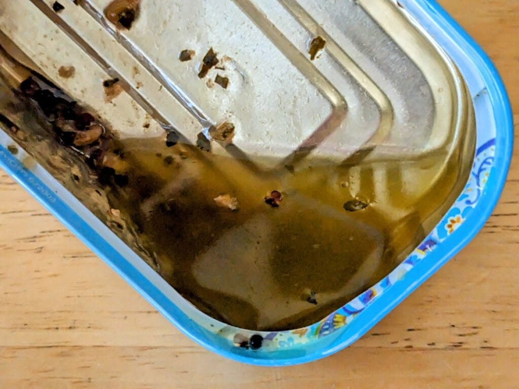 Leftover oil inside a can of Freshe Salmon Moroccan Tagine.