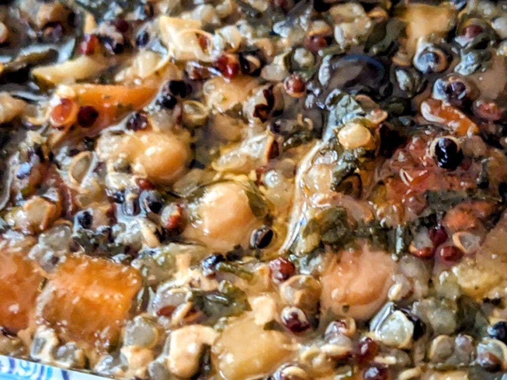Detail of Freshe Salmon Moroccan Tagine canned meal, showing oil and chickpeas and quinoa.