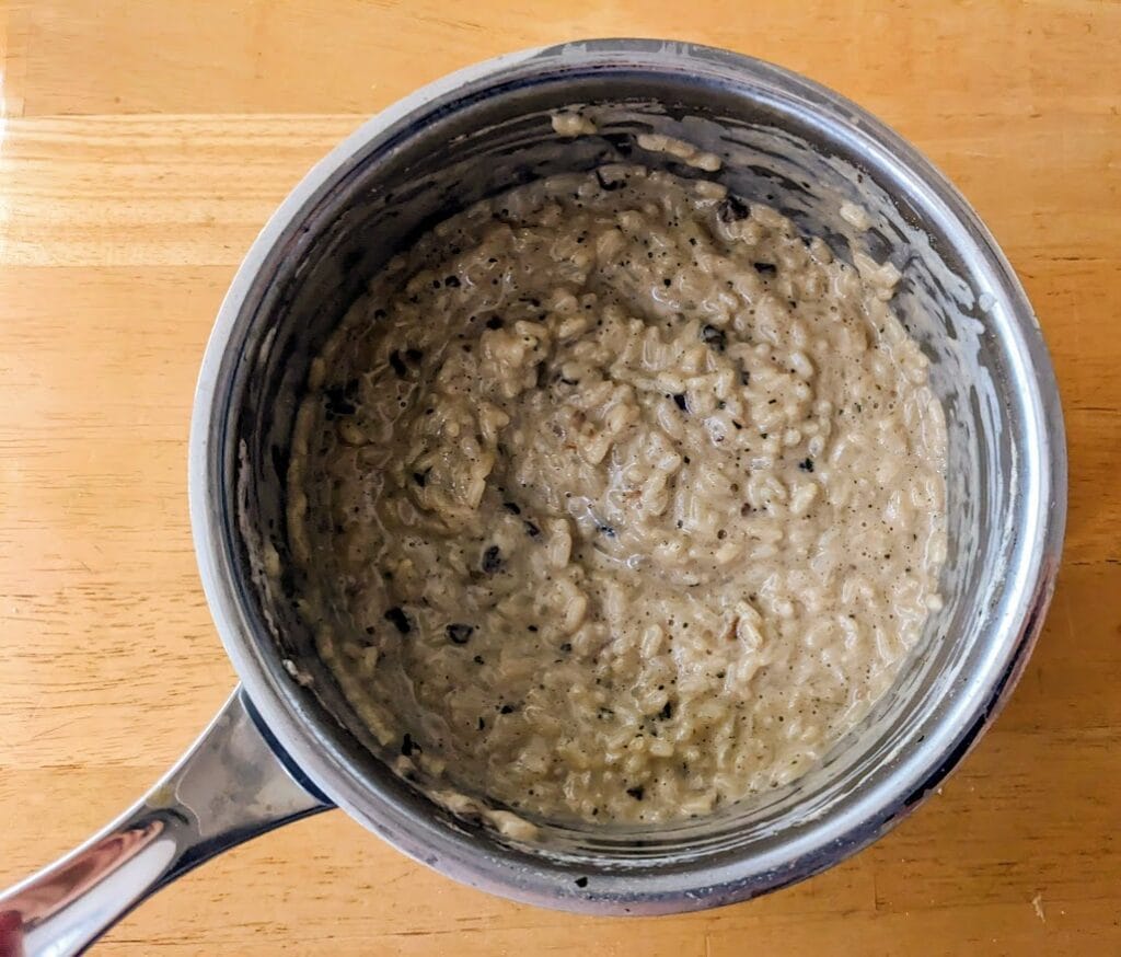 A stainless steel pot filled with Mushroom Risotto from Aldi.