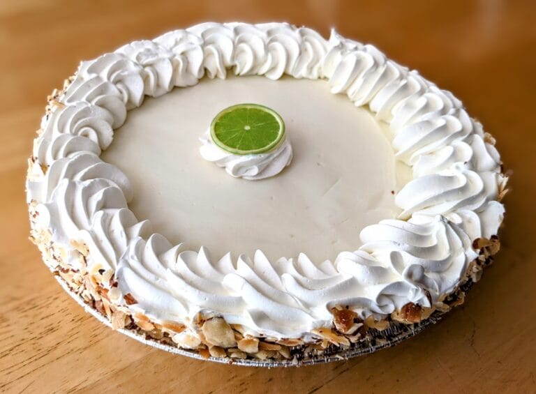 A whole Publix Bakery Key Lime Pie sitting on a kitchen table.