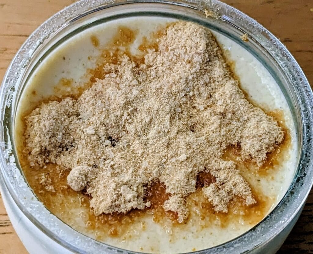 Un-melted brown sugar on top of a dish of Senoble French Creme Brulee.