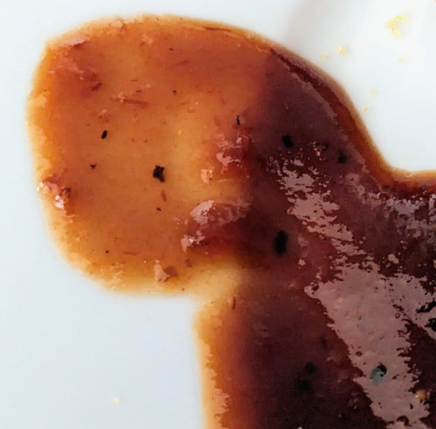 A small puddle of Burman's Kansas City BBQ Sauce from Aldi.