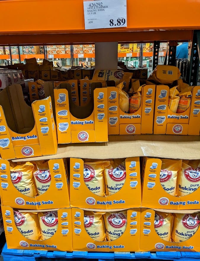 Shelves of Arm & Hammer Baking Soda inside a Costco Warehouse.