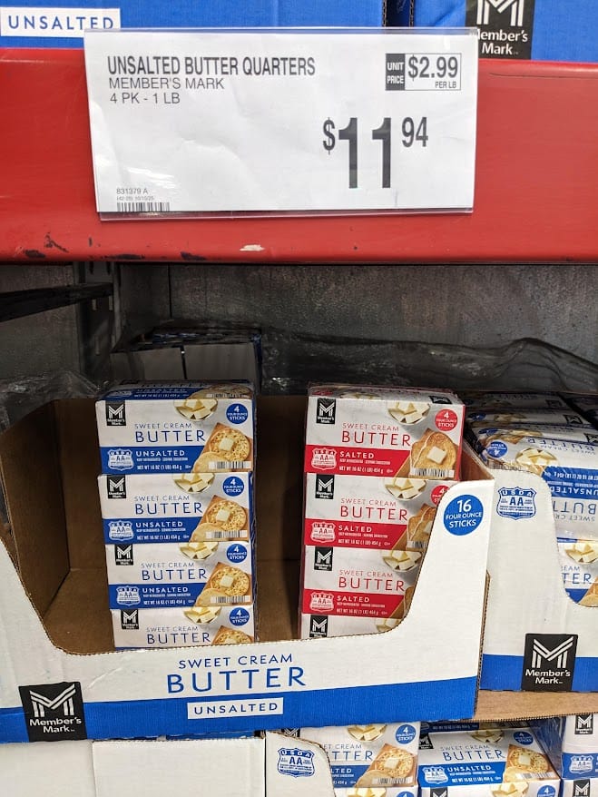 Dairy shelf inside a Sam's Club warehouse, showing 4-pound packages of salted and unsalted butter.
