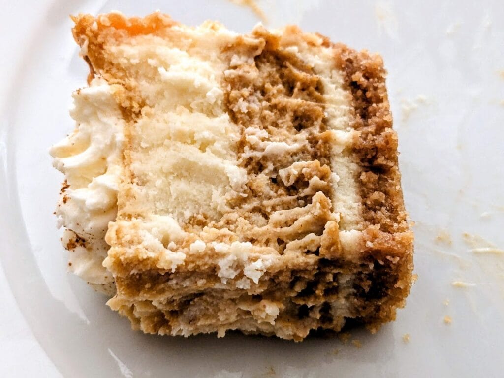 Marbled white and pumpkin layers in a piece of Pumpkin Cheesecake from Sam's Club.