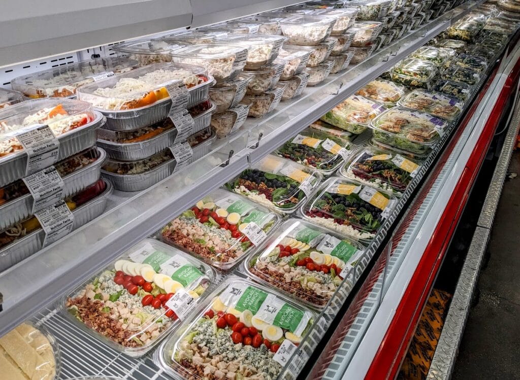 A refrigerated case in the Deli section of Sam's Club.