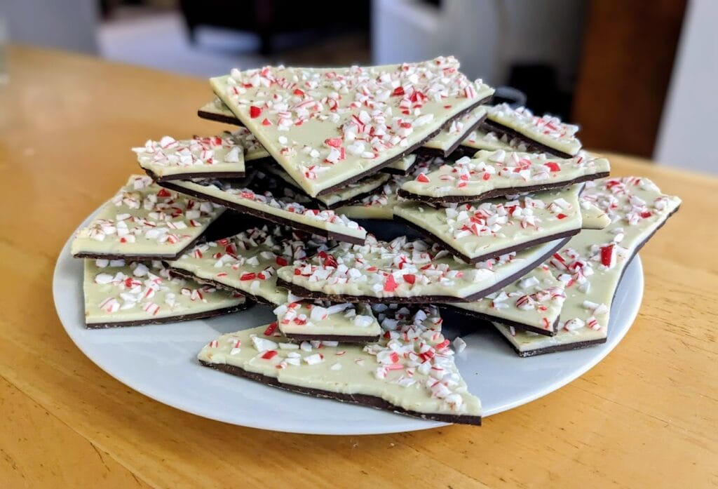 A plate with a pile of Kirkland Peppermint Bark from Costco.