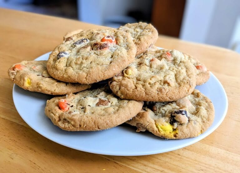 A white plate with a stack of Peanut Butter Monster Cookies from the Costco Bakery.
