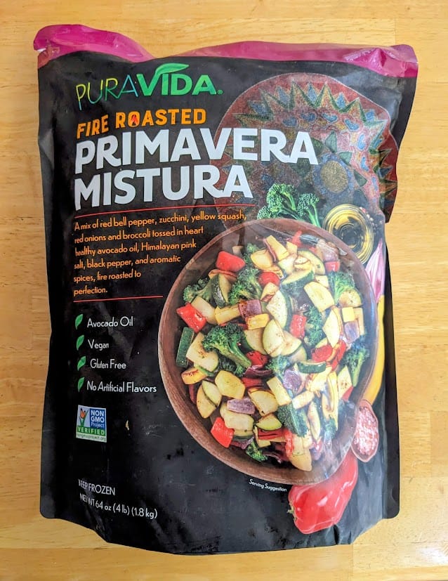 A bag of frozen Pura Vida Fire Roasted Primavera Mistura frozen vegetables from Costco.