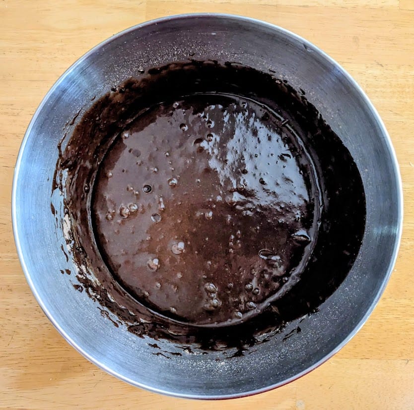 A mixing bowl with prepared Aldi Chewy Fudge Brownie batter.
