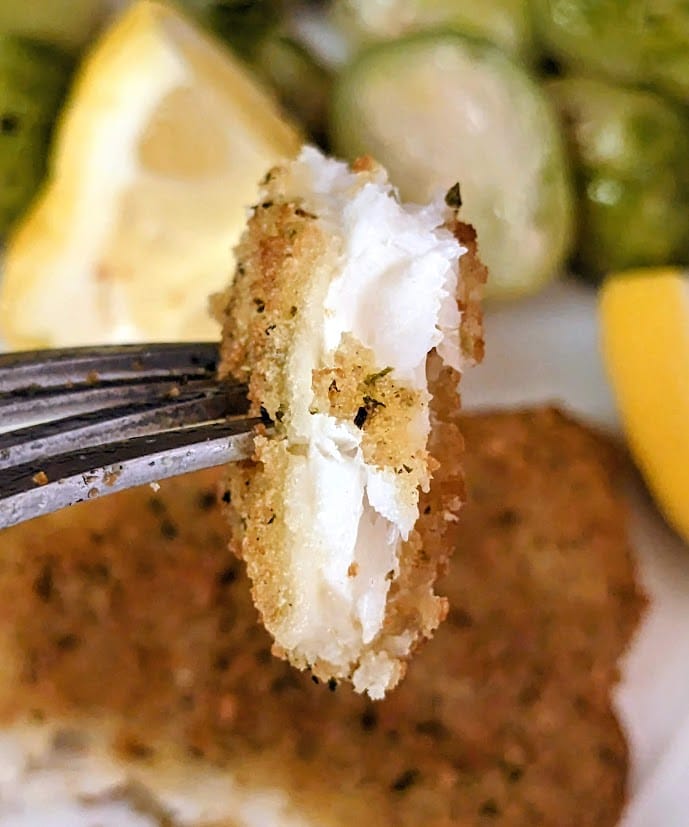 A fork with a bite of Aldi Fremont Fish Market frozen Parmesan Crusted Flounder.