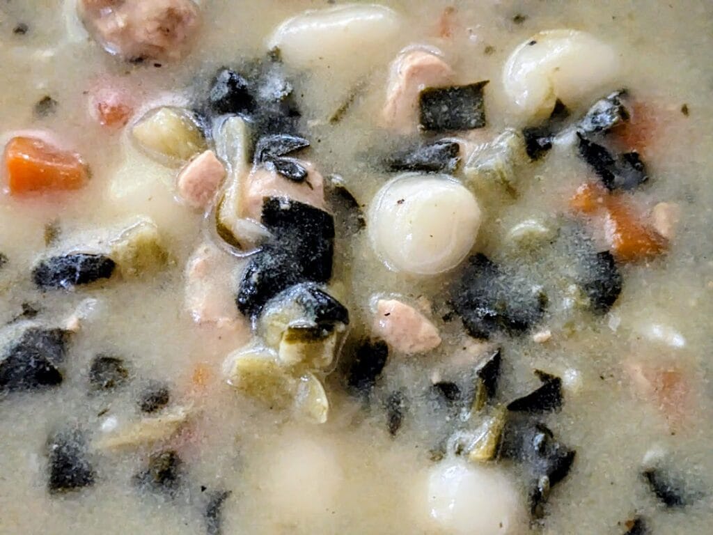 Detail of vegetables, chicken, and gnocchi in Rao's soup.