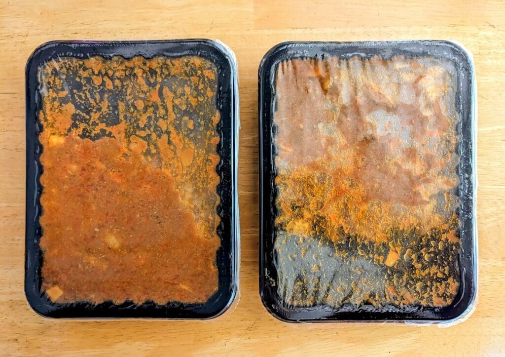 Two sealed plastic trays of Goanese Lamb Vindaloo Curry from Quicklly Indian Food.