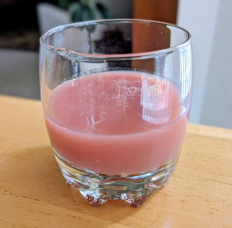 A glass cup of Fruit Cocktail Juice Drink (strawberry, guava, pineapple, apple) from BEST Egypt Canning Co.