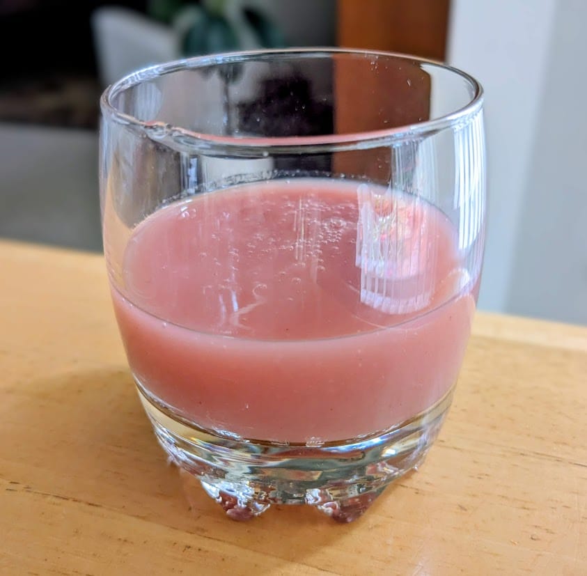 A glass cup of Fruit Cocktail Juice Drink (strawberry, guava, pineapple, apple) from BEST Egypt Canning Co.