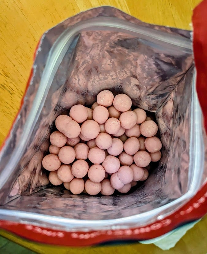 An open bag of Edward Marc Strawberry Shortcake Bites candies.