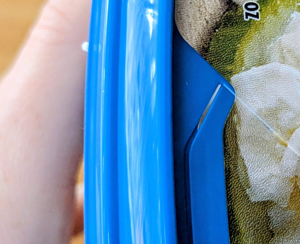 A small crack in the lid of a President brand Feta package.