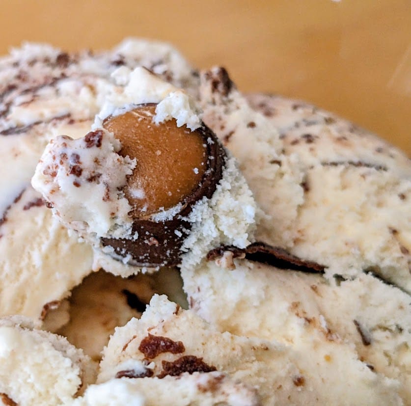 A candy mix-in in a scoop of Publix Buckeyes & Fudge Ice Cream.