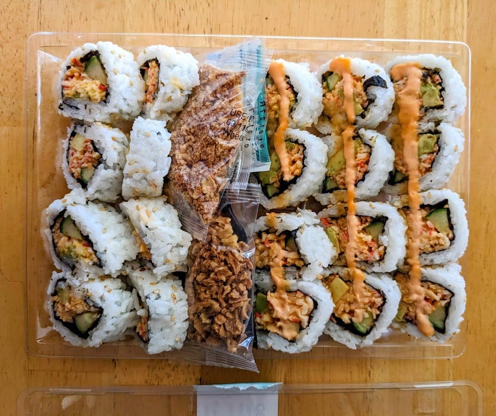 An open package of Costco's California Crunch Combo sushi rolls.