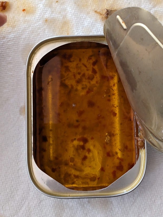 Leftover oil in a can of Fishwife Smoked Mackerel with Chili Flakes.