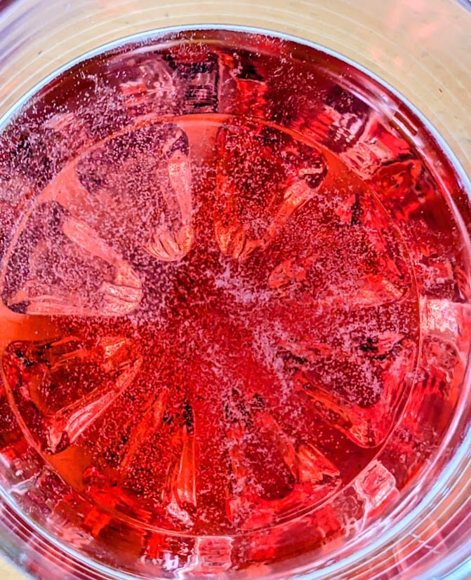 Close up of Jarritos Strawberry Mexican Soda.