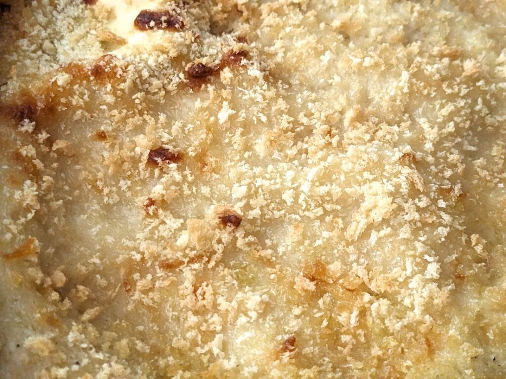 Bread crumb garnish on top of a Rana Chicken Carbonara Lasagna.