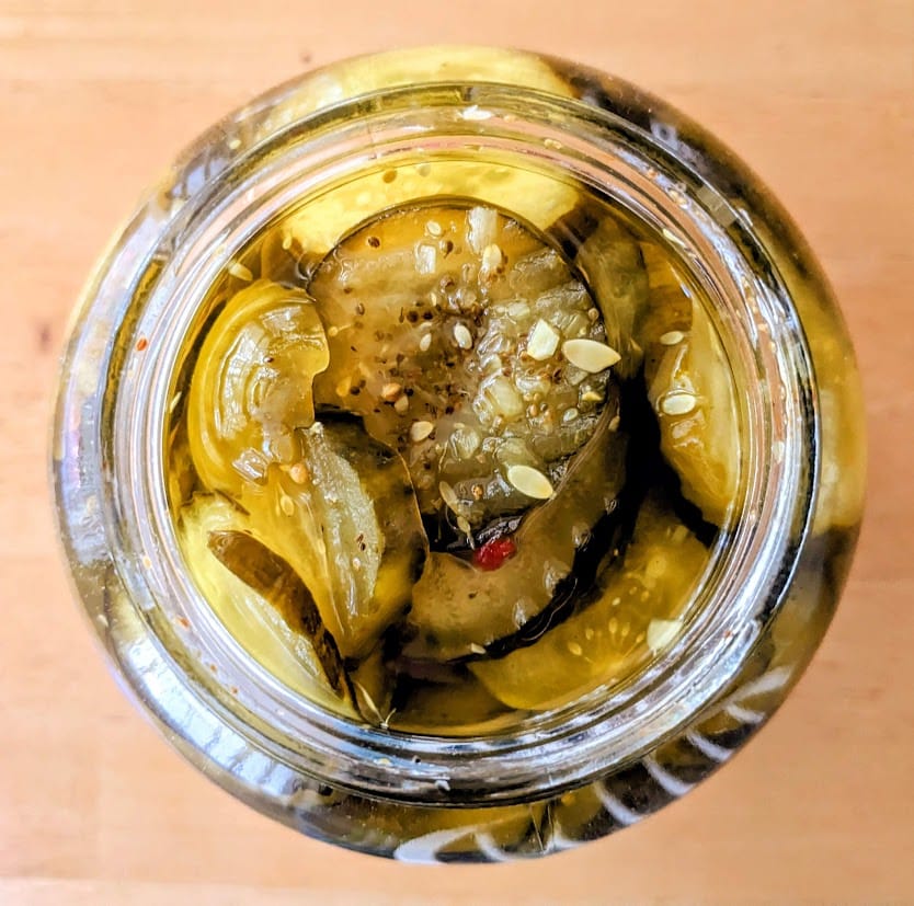 Overhead view looking inside a jar of Bubbies Bread & Butter Pickle Chips from Costco.