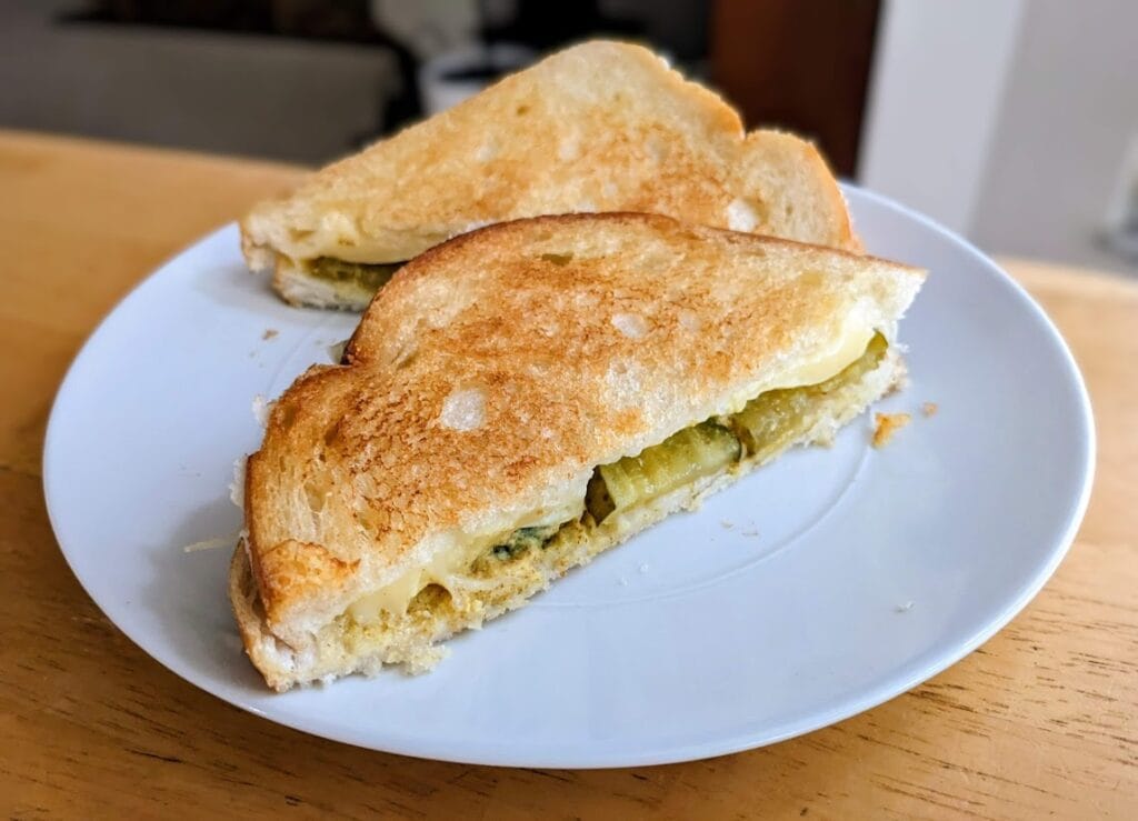 A grilled cheese sandwich filled with Bubbies Bread & Butter Pickle Chips from Costco.