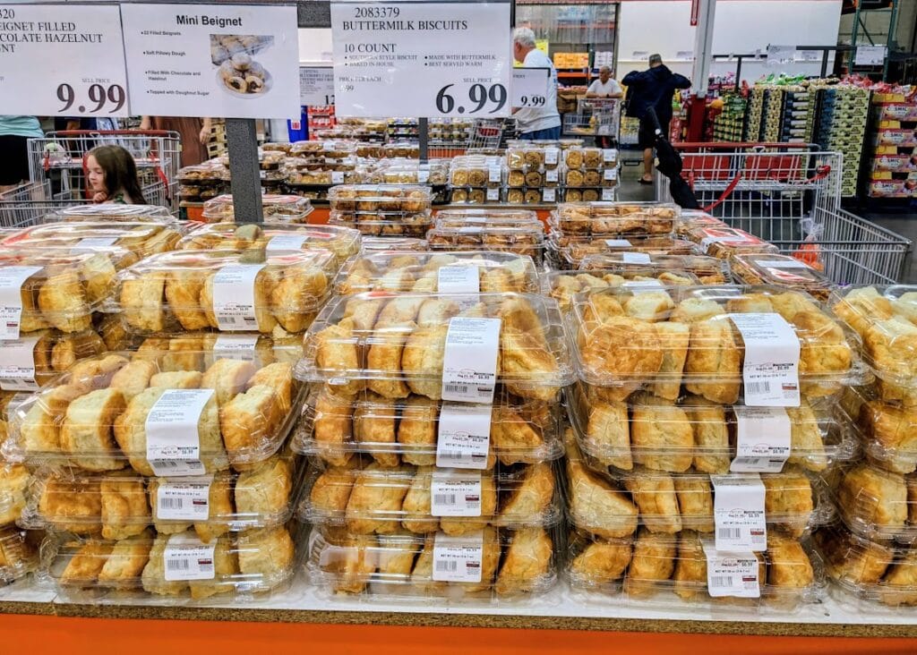 A store display of stacked Buttermilk Biscuit boxes inside a Costco Bakery.