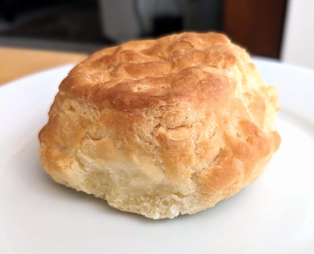 A whole Costco Buttermilk Biscuit sitting on a plate.