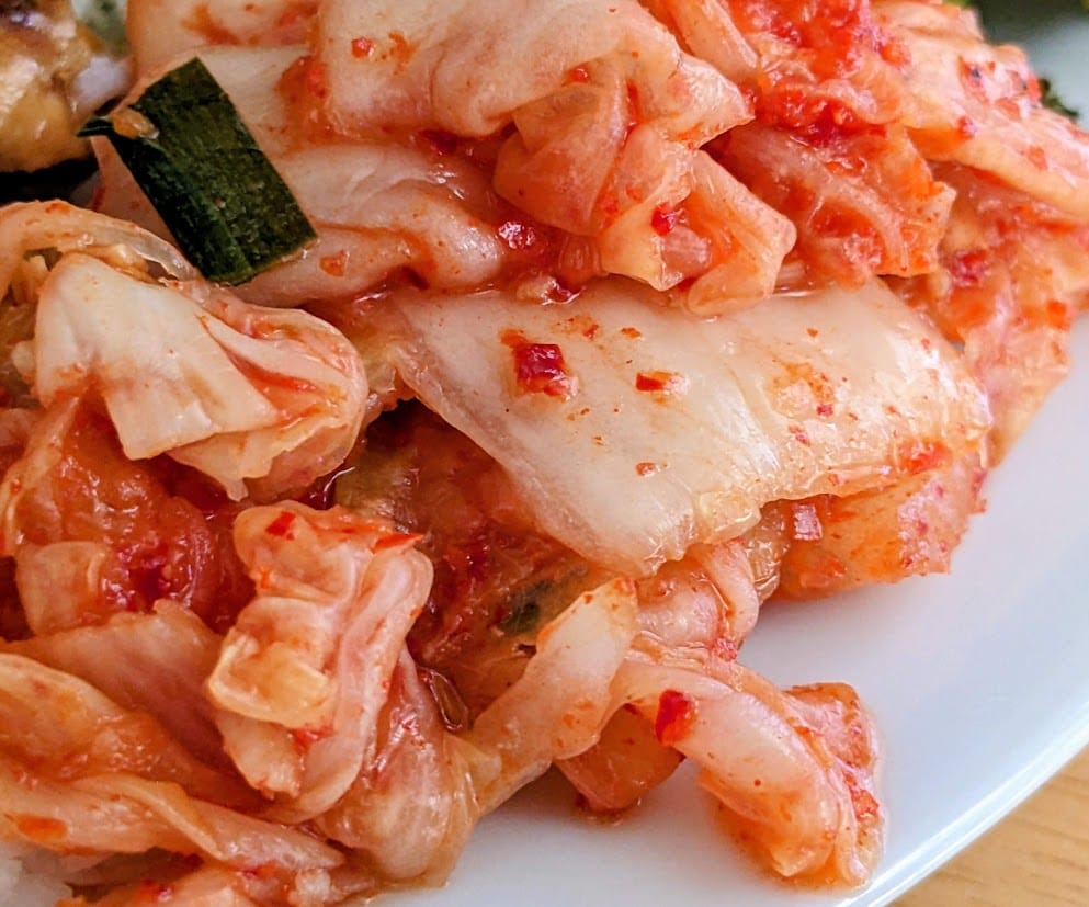 A pile of red cabbage and vegetables from Jongga Korean Kimchi.
