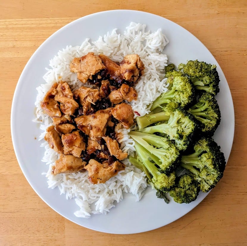 A white plate with basmati rice, broccoli, and Kevin's Hawaiian-Style Chicken.