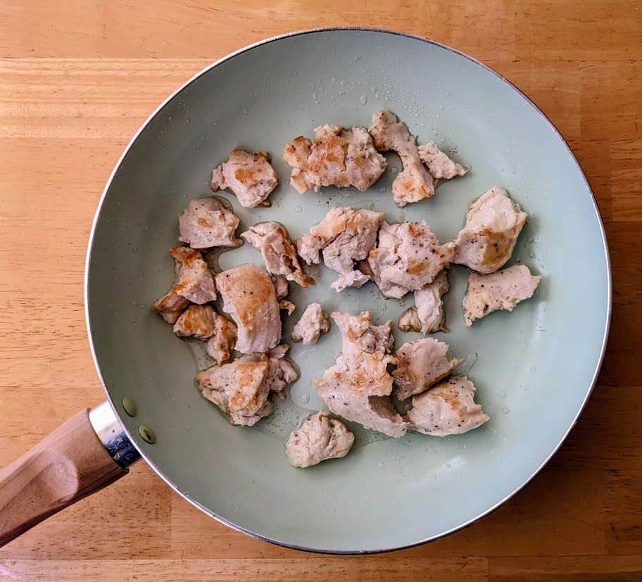 A large ceramic pan with browned meat from Kevins Hawaiian-Style Chicken.