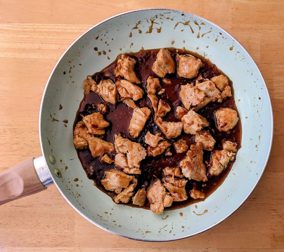 A large ceramic pan filled with meat and sauce from a Kevins Hawaiian-Style Chicken meal.