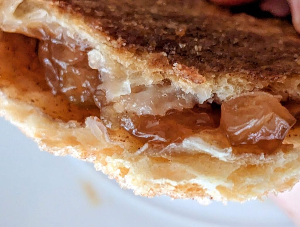 Close up of fruit filling inside a Publix Apple Flip pastry.