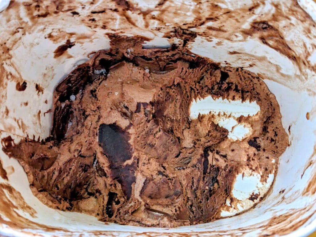 The bottom of a carton of Publix Chocolate Moose Tracks Ice Cream, showing the fudge ribbons.