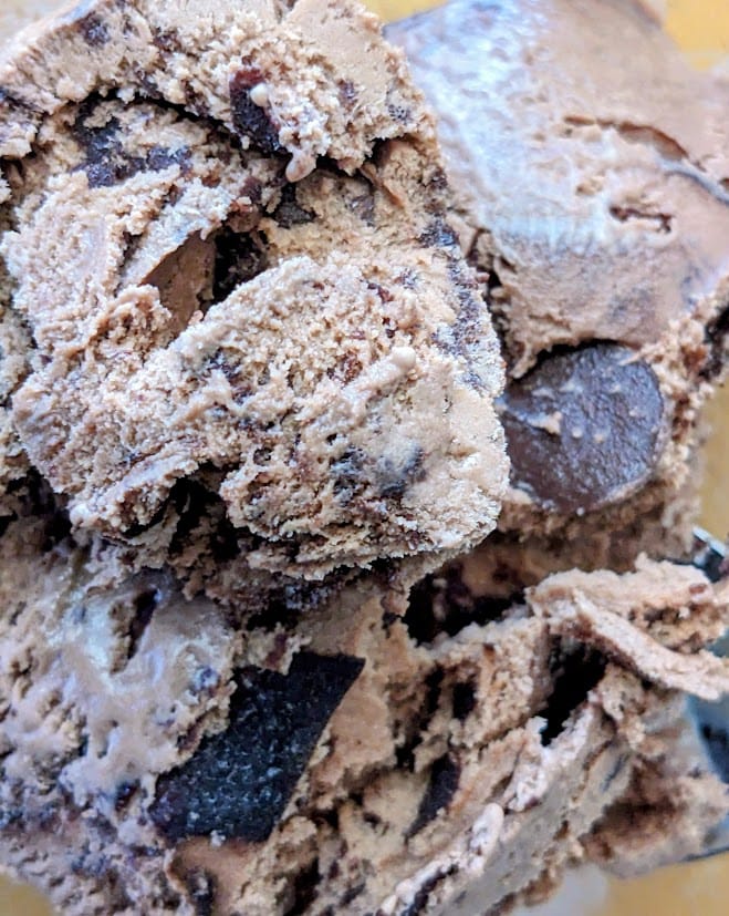 Close up of Publix Chocolate Moose Tracks Ice Cream, showing the peanut butter cup and fudge mix ins.