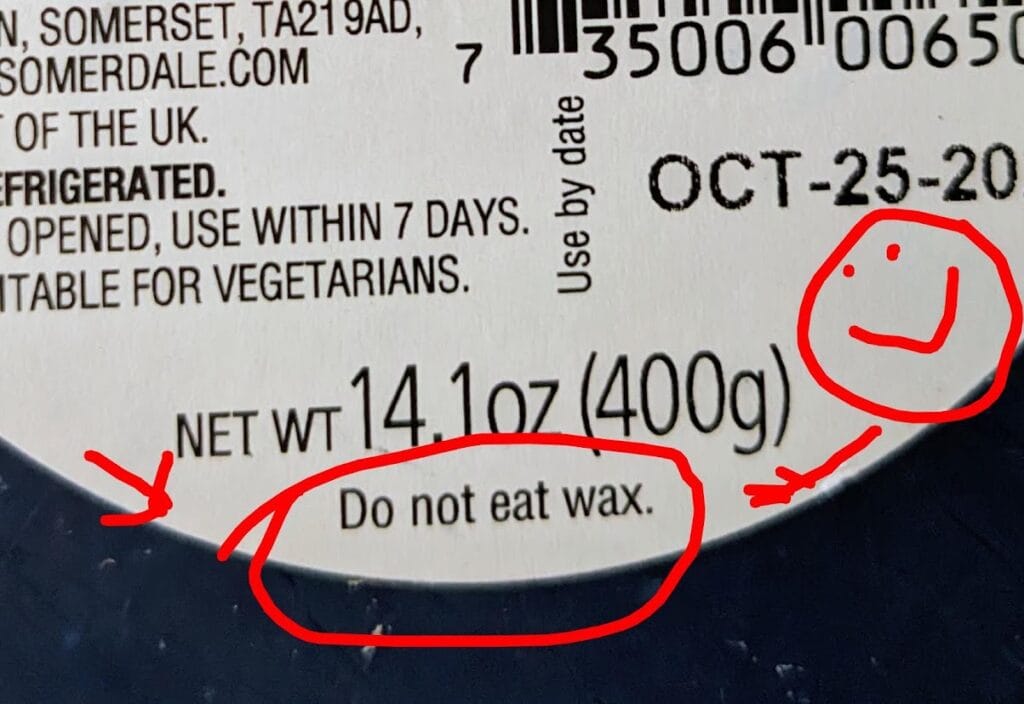Label from a blueberry flavored Wensleydale cheese from Somerdale, showing text that reads: Do not eat wax.