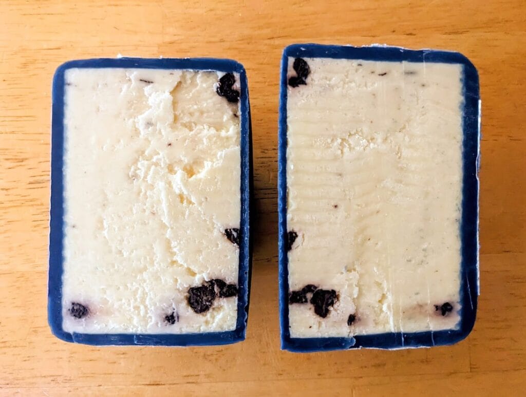 A sliced open wax-coated wheel of Somerdale Wensleydale Blueberry cheese from Costco.