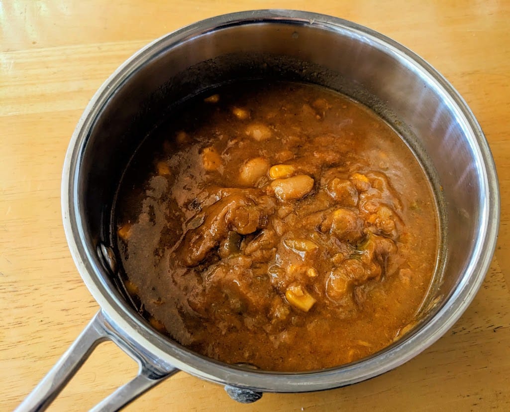 A small stainless steel pan with Zoup White Chicken Chili soup.