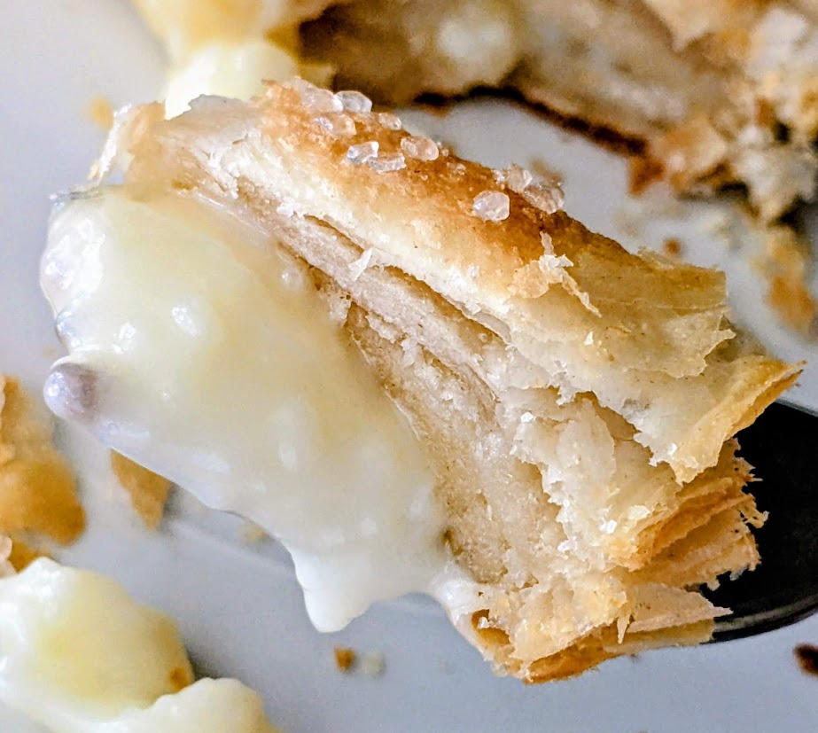 A fork with a bite of Lemon Mascarpone Strudel from Aldi, showing the custard filling.