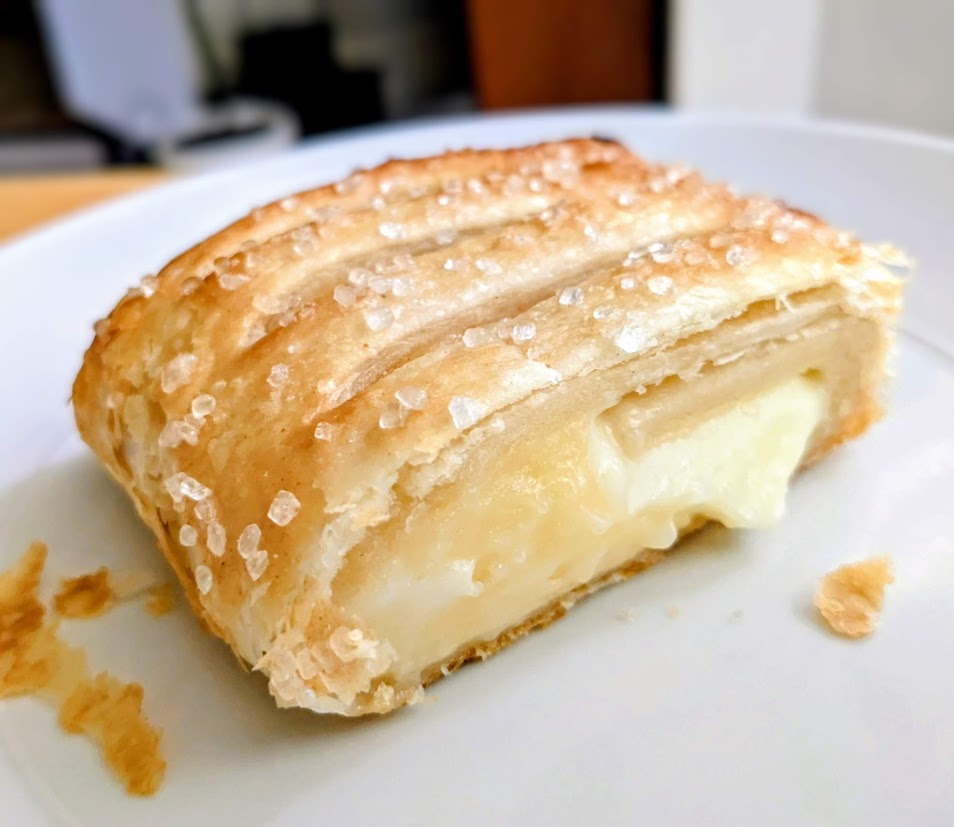 A serving of Aldi Lemon Mascarpone Strudel on a white plate.