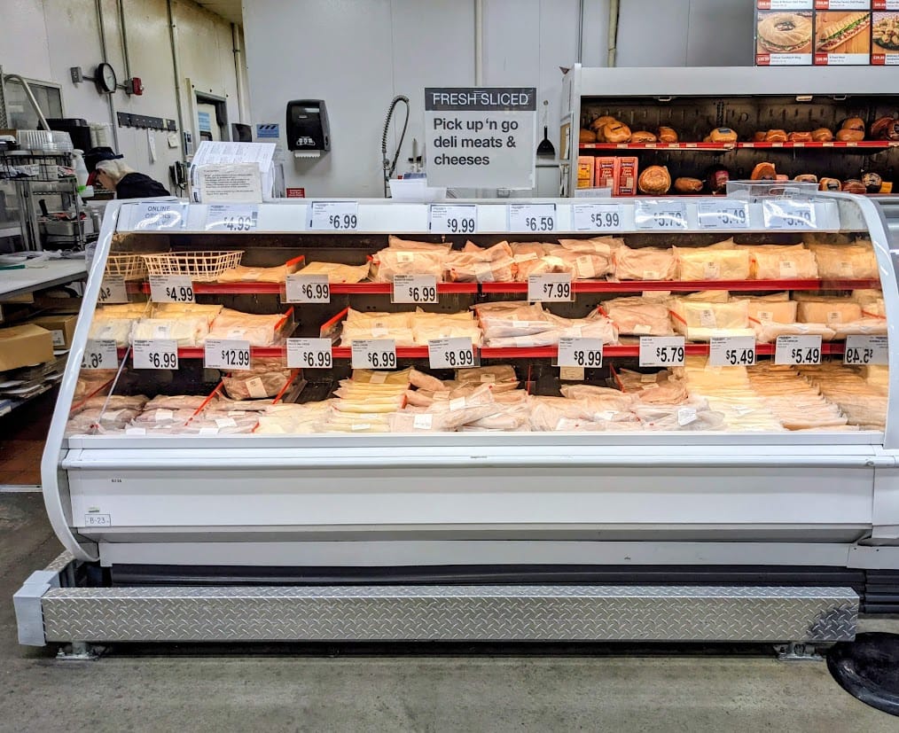 Grab and go pre-sliced meat and cheese inside a Bj's Wholesale Club Deli.