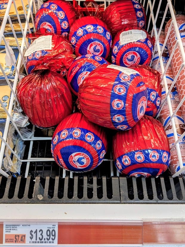 Round Edam Cheeses inside a BJ's Wholesale Club.