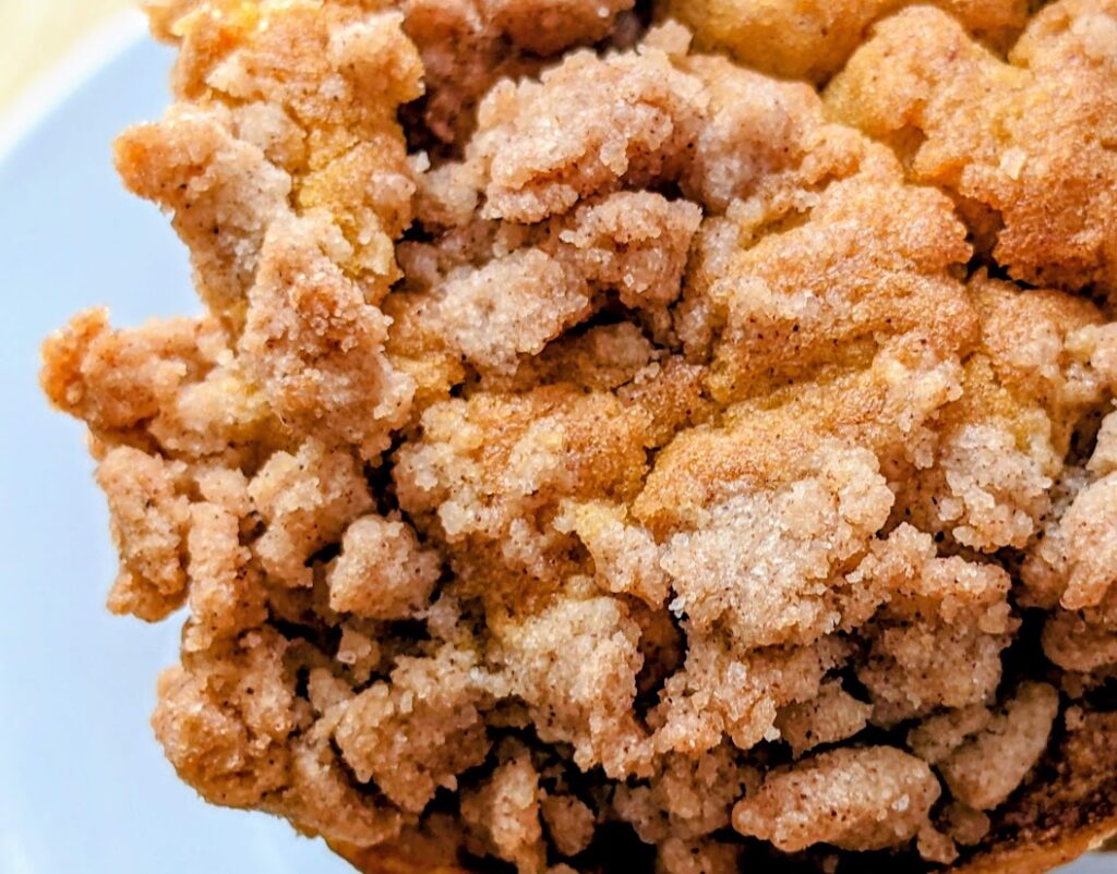Streusel detail from the top of a Costco Pumpkin spice muffin.